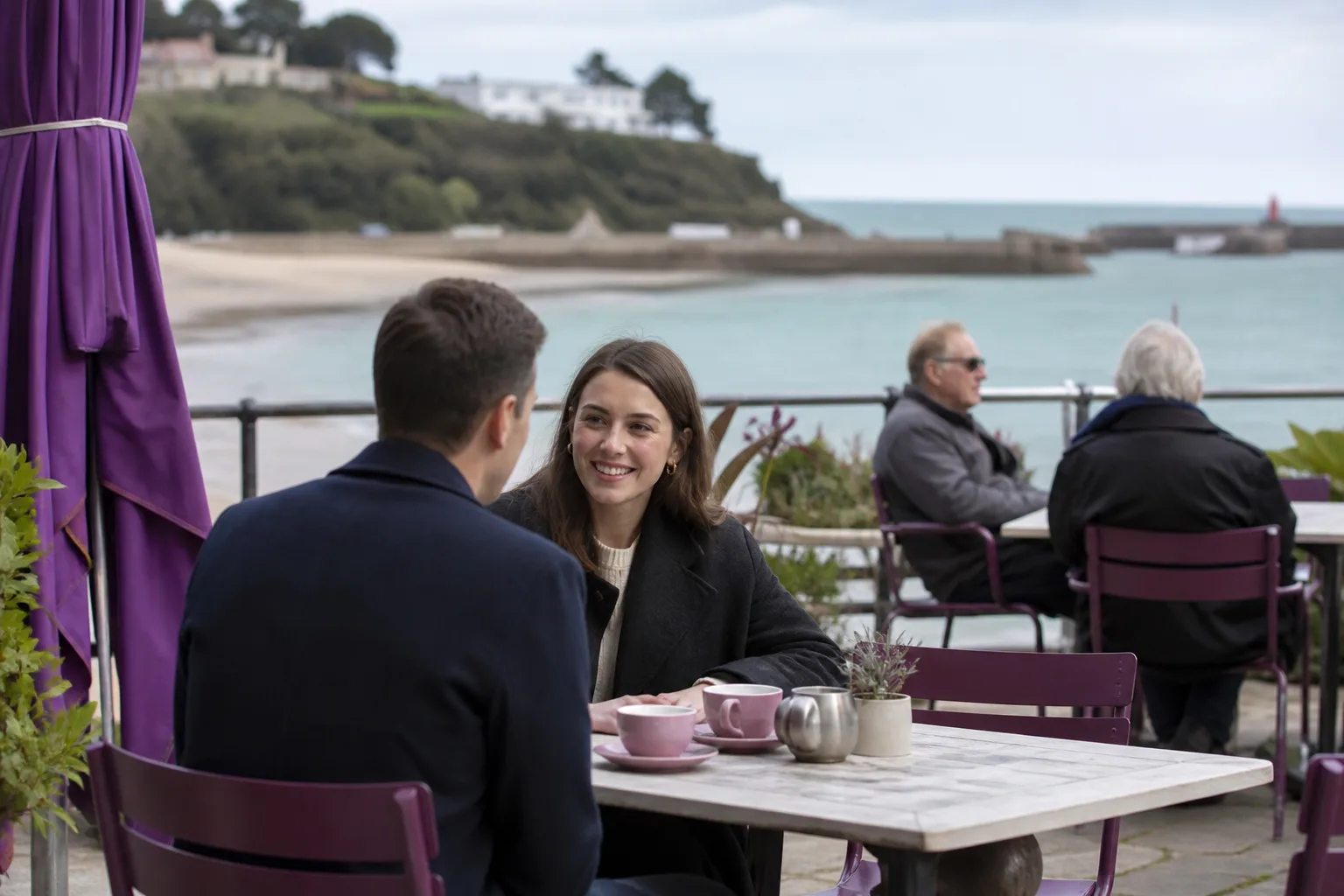Two people talking over coffee in St Helier, Jersey